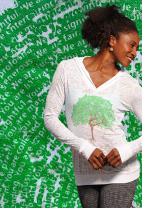 featured image of Think Possible Apparel's dancing tree design screen printed on a lightweight hoody  in the color white