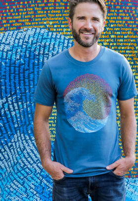 featured image of Think Possible Apparel's great wave design screen printed on a organic cotton tee  in the color deep blue