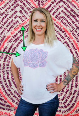 featured image of Think Possible Apparel's lotus flower design screen printed on a organic flowy tee  in the color white