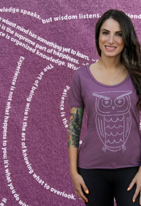featured image of Think Possible Apparel's wise owl design screen printed on a flowy tee  in the color maroon